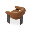 A contemporary armchair by Liang & Eimil with a statement boucle upholstery and stylish black ash wood legs