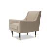 Light brown lounge chair featuring legs of solid wood capped with polished brass cups