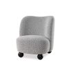 A contemporary armchair by Liang & Eimil with a gorgeous grey upholstery and round black feet