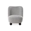 A contemporary armchair by Liang & Eimil with a gorgeous grey upholstery and round black feet