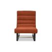 A contemporary chair by Liang & Eimil with a rust upholstery and stylish shape