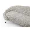 A stylish curved sofa with a gorgeous grey upholstery