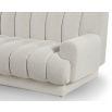 A contemporary sofa with a beautiful boucle upholstery and channel stitching