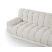 A contemporary sofa with a beautiful boucle upholstery and channel stitching