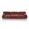 A statement modular sofa with a stylish rust upholstery and deep buttoned design
