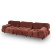 A statement modular sofa with a stylish rust upholstery and deep buttoned design