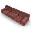 A statement modular sofa with a stylish rust upholstery and deep buttoned design