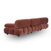 A statement modular sofa with a stylish rust upholstery and deep buttoned design