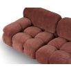 A statement modular sofa with a stylish rust upholstery and deep buttoned design