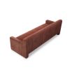 A modern sofa with a statement rust upholstery and scatter cushions