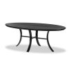 Oval shaped black ash dining table with curved legs