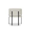 Squared wrap-around chair with neutral upholstery and black frame