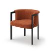Gorgeous boucle upholstered dining chair in rust with black frame