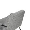 Grey upholstered armchair with slim black steel frame