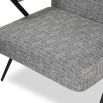 Grey upholstered armchair with slim black steel frame
