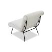 Neutral boucle upholstered armchair with rolled-back