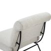 Neutral boucle upholstered armchair with rolled-back