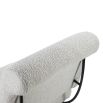 Neutral boucle upholstered armchair with rolled-back