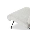 Neutral boucle upholstered armchair with rolled-back