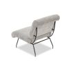 Grey upholstered armchair with rolled back