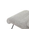 Grey upholstered armchair with rolled back