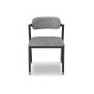 Black and white patterned chair with slanted back legs and brass capped feet