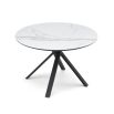 Round, white marble top dining table with dynamic crossed over legs