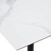 Square dining table with white marble top and brass base