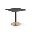 Square dining table with grey top and brass base