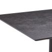Square dining table with grey top and brass base