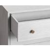 A luxury chest of drawers with grey and bronze finish