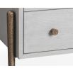 A luxury chest of drawers with grey and bronze finish
