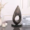 Coffee-coloured marble candle holder with cut-out design