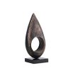 Coffee-coloured marble candle holder with cut-out design