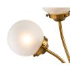 Brass wall fixture with two splayed orb lights