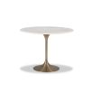 White marble dining table sitting atop brass base