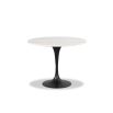 White marble dining table sitting atop a black metal base