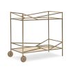 A luxury bar cart by Caracole with a glamorous gold finish