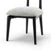 A statement dining chair with a gorgeous grey upholstery