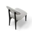 A statement dining chair with a gorgeous grey upholstery