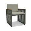 A stylish outdoor dining chair with grey strapping and bespoke sunbrella cushions 