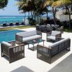 A luxury outdoor sofa from Willow's Outdoor collection with a bespoke sunbrella cushion upholstery and grey strapping