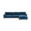 A mesmerising, deep blue corner sofa with brushed brass feet