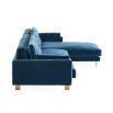 A mesmerising, deep blue corner sofa with brushed brass feet