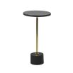 A simplistic but elegant side table crafted from black marble and brass