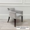 Sumptuous grey velvet chair with black, tapered back legs and pen mark on bottom of backrest 