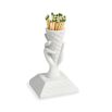 A glamorous ice cream cone-shaped porcelain match strike