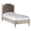 kids bed in natural wood with wicker headboard