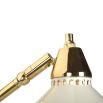 A spectacularly chic task floor standing lamp with a polished brass and white lacquered finish