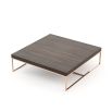 A chic modern coffee table with a copper frame and wooden surface 